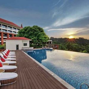 stunning outdoor infinity pool with sun beds at DoubleTree by Hilton Goa - Panaji.