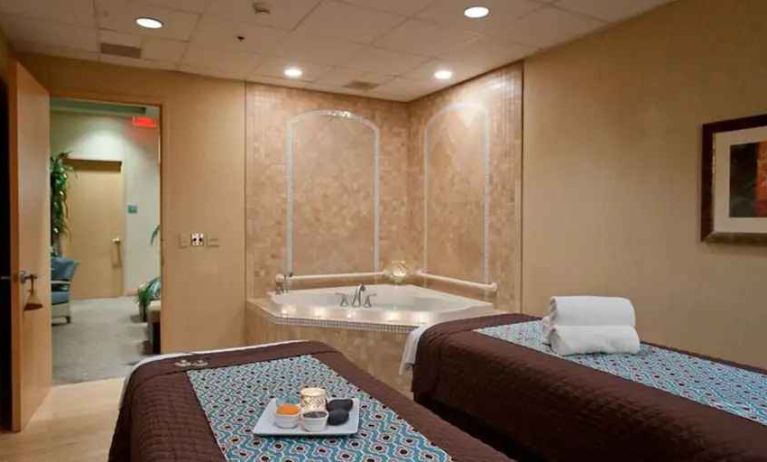 Spa with jacuzzi and massage tables at the Embassy Suite by Hilton Charlotte-Concord- Golf Resort & Spa.