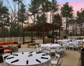 Outdoor patio suitable as workspace at the Embassy Suite by Hilton Charlotte-Concord- Golf Resort & Spa.