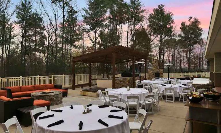 Outdoor patio suitable as workspace at the Embassy Suite by Hilton Charlotte-Concord- Golf Resort & Spa.