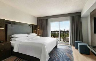 Comfortable king room at the Embassy Suites by Hilton Los Angeles Downey.