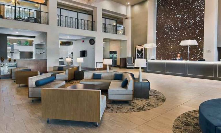 Lobby workspace with sofas at the Embassy Suites by Hilton Los Angeles Downey.