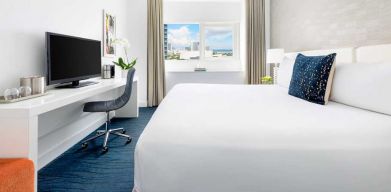 King bedroom with desk at the YVE Hotel Miami.