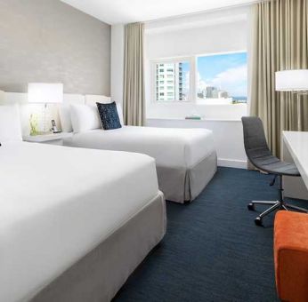 Twin room with desk at the YVE Hotel Miami.