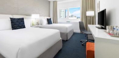 Twin room with desk at the YVE Hotel Miami.