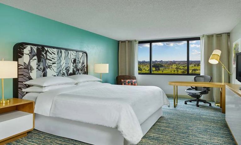 King bedroom with desk at the Sheraton Miami Airport Hotel.