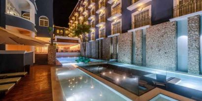 Pool by night at the Villa Mercedes Merida, Curio Collection by Hilton.