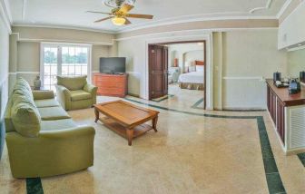 Living room in a hotel suite at the Villa Mercedes Merida, Curio Collection by Hilton.