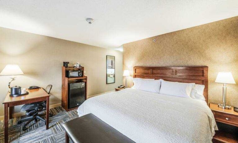 King bedroom with desk at the Hampton Inn Greenfield.