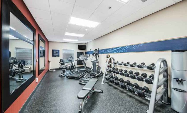 Fitness center with mirror at the Hampton Inn Greenfield.