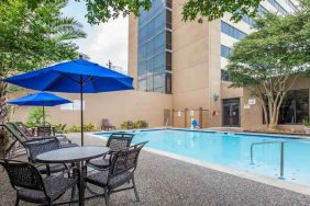 Relaxing outdoor pool area at the Doubletree by Hilton Houston Medical Center Hotel & Suites.