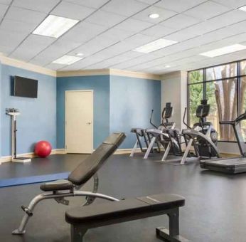 Fitness center with treadmills at the Doubletree by Hilton Houston Medical Center Hotel & Suites.