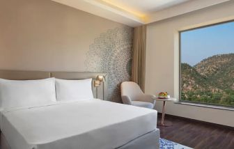 Hotel room with large window at the DoubleTree by Hilton Jaipur Amer.