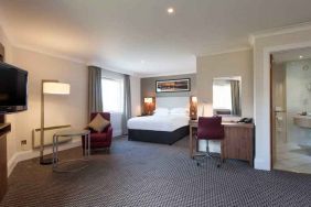 Spacious hotel suite with working station at the Doubletree by Hilton Glasgow Strathclyde.