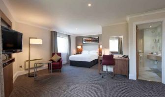 Spacious hotel suite with working station at the Doubletree by Hilton Glasgow Strathclyde.