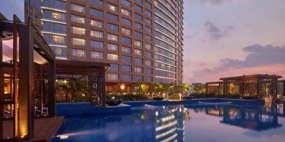 Relaxing outdoor pool at the Conrad Bengaluru.