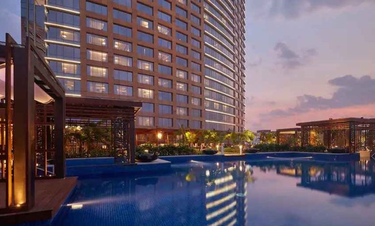 Relaxing outdoor pool at the Conrad Bengaluru.