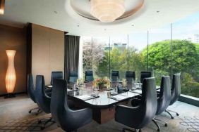 Meeting room with large window at the Conrad Bengaluru.