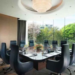 Meeting room with large window at the Conrad Bengaluru.