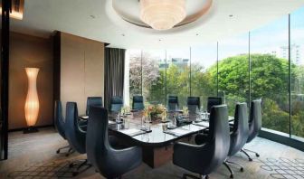 Meeting room with large window at the Conrad Bengaluru.