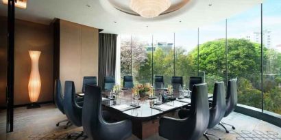 Meeting room with large window at the Conrad Bengaluru.