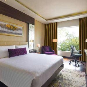 King bedroom with desk at the DoubleTree by Hilton Gurugram Baani Square.