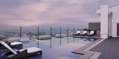 Relaxing outdoor pool at the DoubleTree by Hilton Gurugram Baani Square.