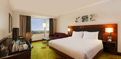 King bedroom with desk at the Hilton Garden Inn New Delhi/Saket.