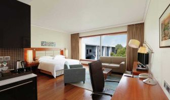 Spacious hotel room with working station at the Hilton Bangalore Embassy GolfLinks.