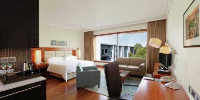 Spacious hotel room with working station at the Hilton Bangalore Embassy GolfLinks.