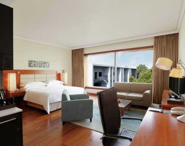 Spacious hotel room with working station at the Hilton Bangalore Embassy GolfLinks.