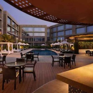 Seating area by the pool perfect as workspace at the Hilton Bangalore Embassy GolfLinks.