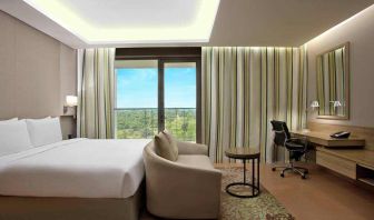 Comfortable hotel room at the DoubleTree Suites by Hilton Bangalore.