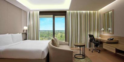 Comfortable hotel room at the DoubleTree Suites by Hilton Bangalore.