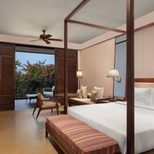 King bedroom with desk at the Hilton Goa Resort.