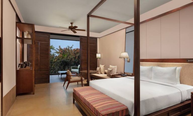 King bedroom with desk at the Hilton Goa Resort.