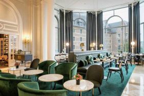 Seating area perfect as workspace at the Hilton Brussels Grand Place .