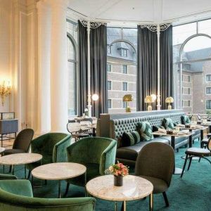 Seating area perfect as workspace at the Hilton Brussels Grand Place .