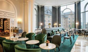 Seating area perfect as workspace at the Hilton Brussels Grand Place .