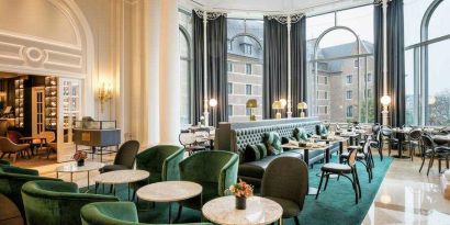 Seating area perfect as workspace at the Hilton Brussels Grand Place .