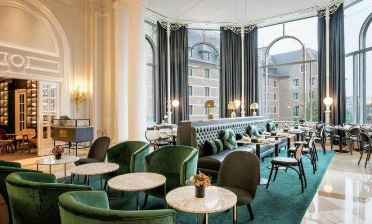 Seating area perfect as workspace at the Hilton Brussels Grand Place .