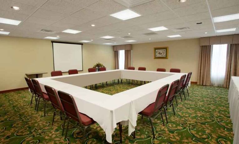 Conference room with square table at the Hampton Inn Sidney.