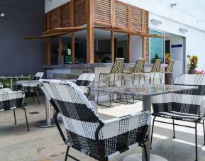 Outdoor patio perfect as workspace at the Hampton by Hilton Cartagena.