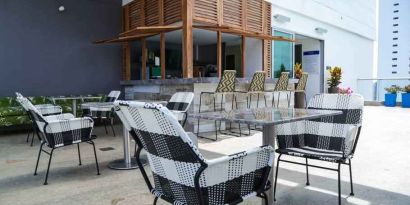 Outdoor patio perfect as workspace at the Hampton by Hilton Cartagena.