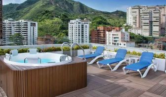 Outdoor terrace with pool at the Hampton by Hilton Cali.