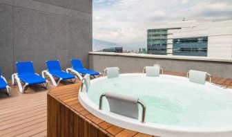 Outdoor terrace with pool at the Hampton by Hilton Medellin Antioquia.