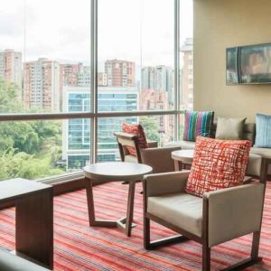 Bright hotel workspace at the Hampton by Hilton Medellin Antioquia.