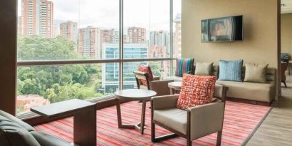 Bright hotel workspace at the Hampton by Hilton Medellin Antioquia.