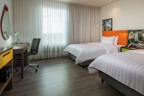 Twin room with working station at the Hampton by Hilton Bogota Airport.