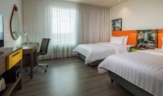 Twin room with working station at the Hampton by Hilton Bogota Airport.